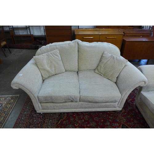 43 - A Duresta Harrington Hogarth two piece sand fabric lounge suite, comprising three seater settee and ... 