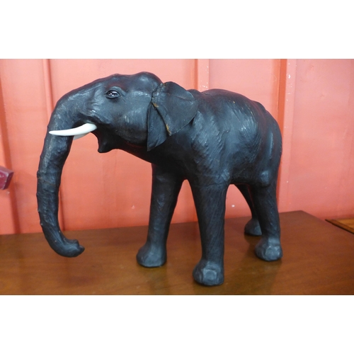 55 - A small leather figure of an elephant