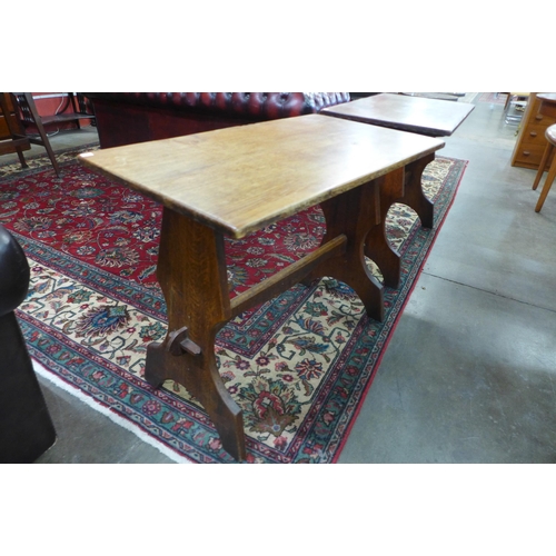 61 - A pair of small Arts and Crafts oak refectory tables