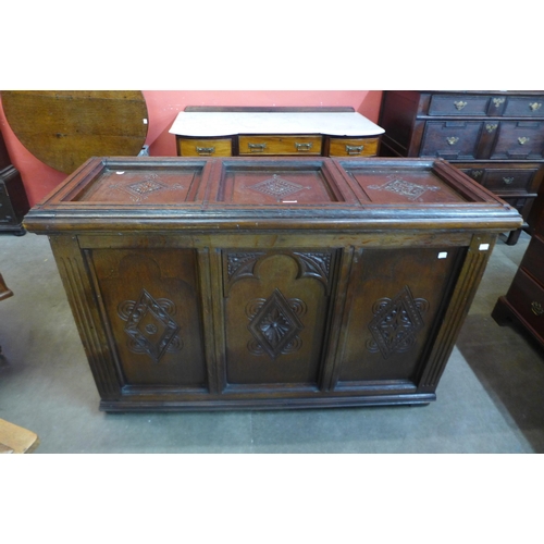 74 - An early 20th Century  Gothic Revival carved oak blanket chest