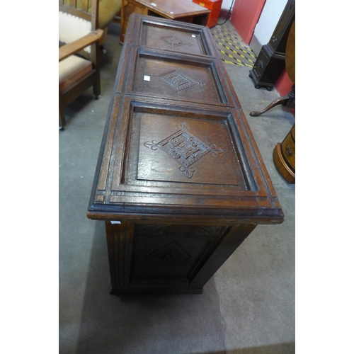 74 - An early 20th Century  Gothic Revival carved oak blanket chest