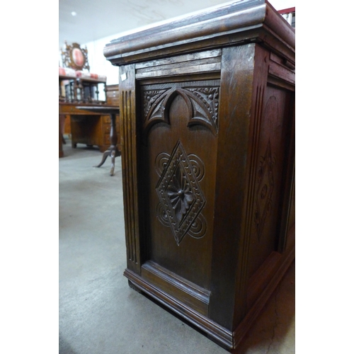 74 - An early 20th Century  Gothic Revival carved oak blanket chest