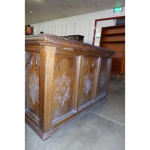 74 - An early 20th Century  Gothic Revival carved oak blanket chest