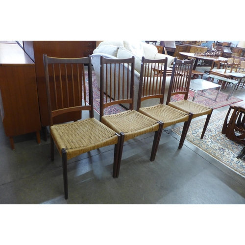 8 - A set of four Danish Mogens Kold teak and cord seated dining chairs, designed by Arne Hovmand Olsen