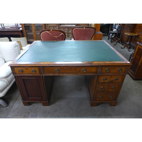 82 - An Edward VII mahogany and green leather topped partner's desk