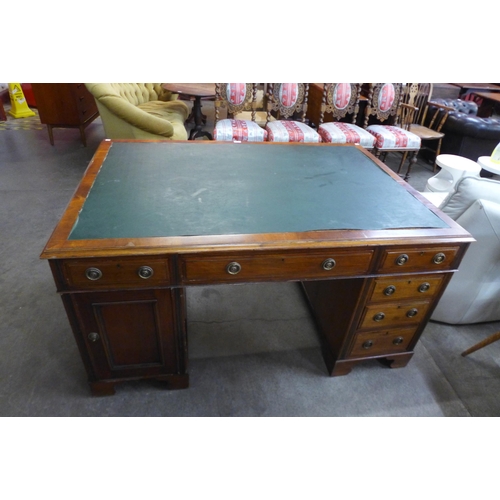 82 - An Edward VII mahogany and green leather topped partner's desk