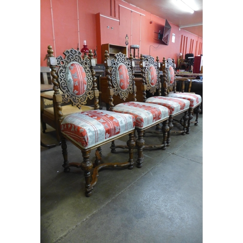 83 - A set of four Victorian carved mahogany and upholstered dining chairs