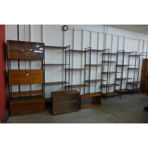 9 - A teak and black metal seven bay modular room divider