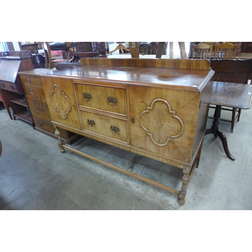 91 - A Queen Anne style walnut sideboard