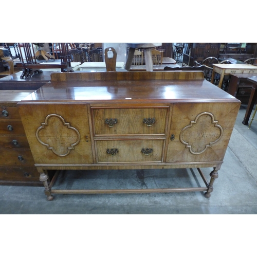 91 - A Queen Anne style walnut sideboard