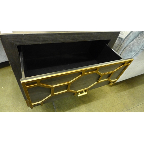 1316 - A black two drawer chest with gold detail