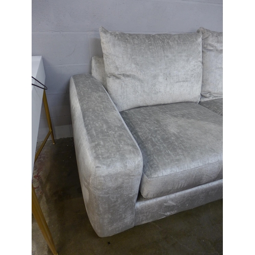 1369 - A silver velvet two seater sofa