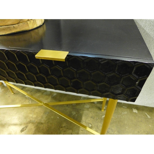 1394 - A black console table with gold legs