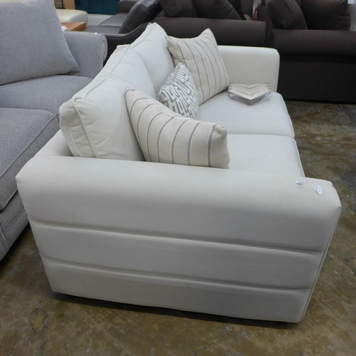 1399 - A Coconut velvet upholstered two seater sofa