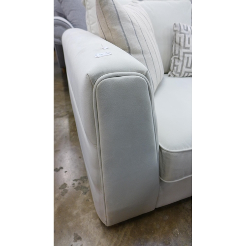 1399 - A Coconut velvet upholstered two seater sofa