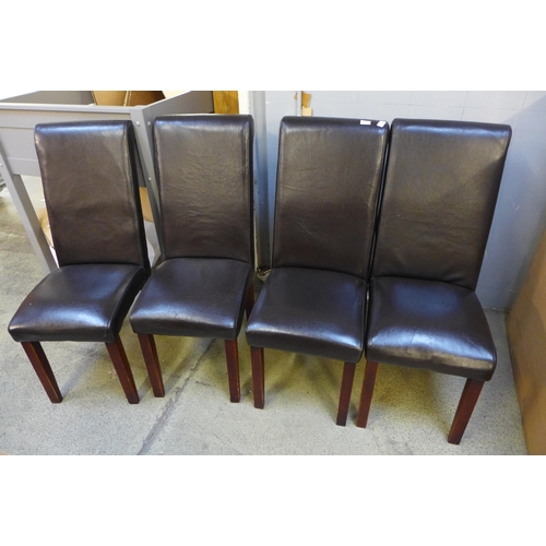 1481 - A set of four brown leather dining chairs