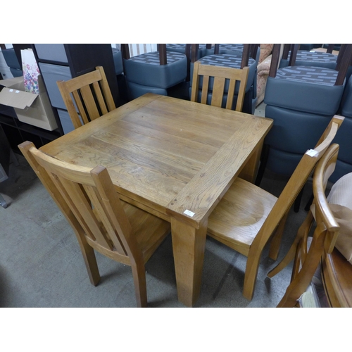 1488 - A square oak dining table and four chairs