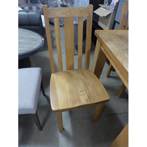 1488 - A square oak dining table and four chairs