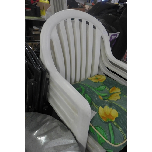 2364 - 4 White plastic garden chairs