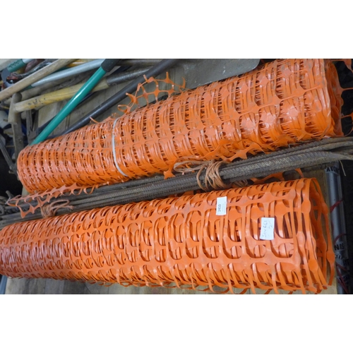 2410 - Two 15mtr rolls of orange barrier fencing with approx. 15 wrought iron poles