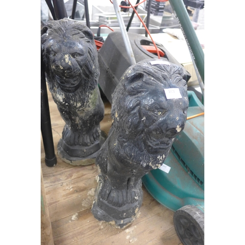 2413 - Pair of black painted stone lion garden ornaments