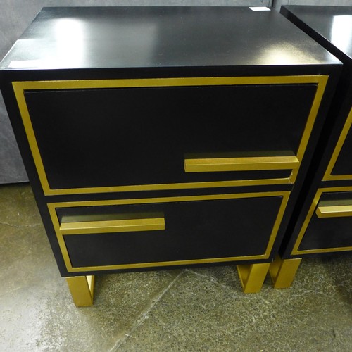1423 - A pair of black bedside tables with gold legs