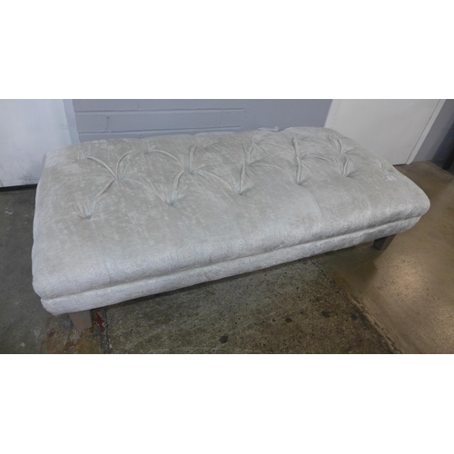 1367 - A cream velvet buttoned footstool