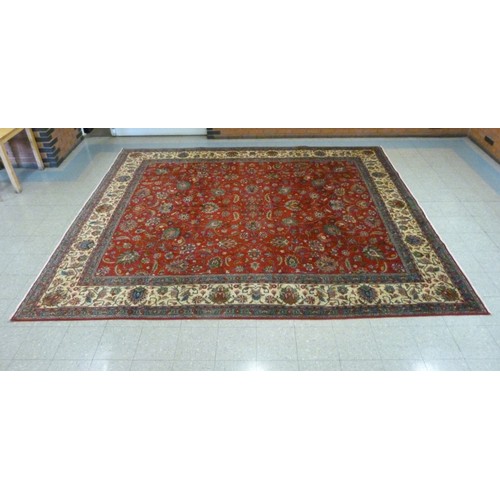 139 - An early 20th Century Persian red ground Tabriz rug, 396 x 335cms