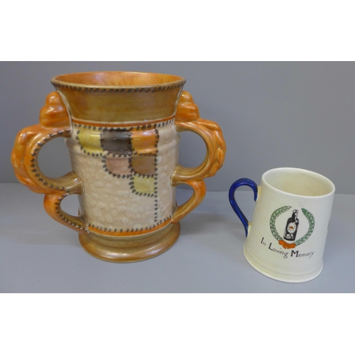 605 - A Crown Ducal three handled vase and a Carlton ware In Loving Memory mug