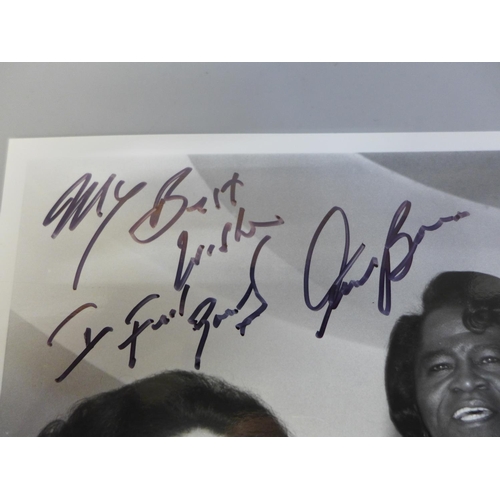 618 - A James Brown autographed press photograph