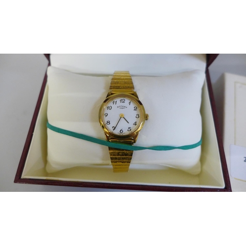 630 - A lady's Rotary wristwatch, boxed and an Imhof brass 8-day mantel timepiece with decorative Regency ... 
