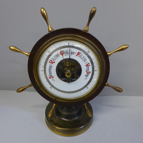 637 - A nautical style convex mirror and a barometer