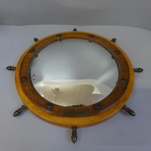 637 - A nautical style convex mirror and a barometer