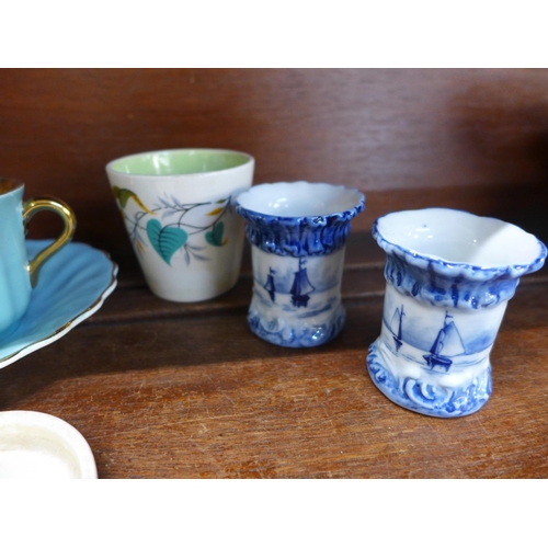 649 - A Wade tea cup and saucer, a pair of Delft small vases, a USSR panda, a Wade flower pot and a Burlin... 