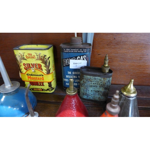 651 - Eight vintage oil cans including Valvespout, PlusGas and a tin of Colman's Mustard tin with original... 