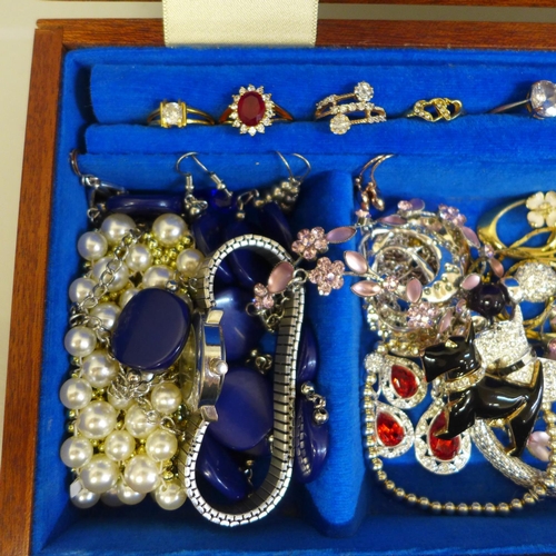 659 - A wooden box containing costume jewellery