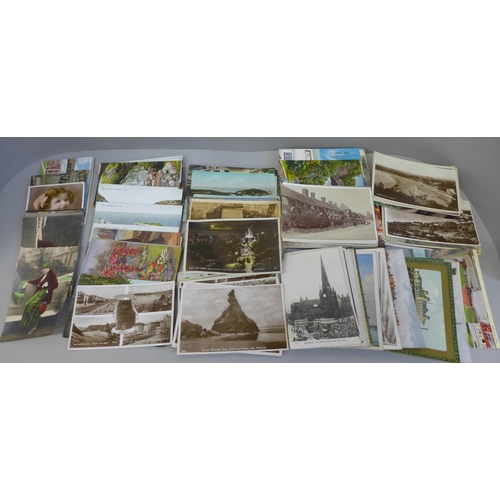 669 - A box of approximately 130 Edwardian and later photographic postcards