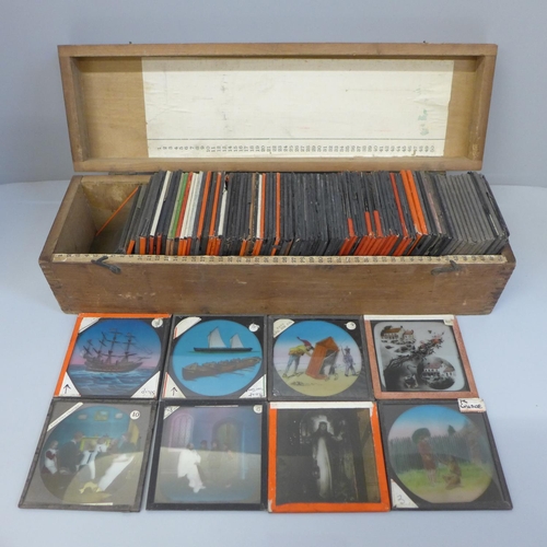 679 - A box of approximately 100 magic lantern slides, colour stories