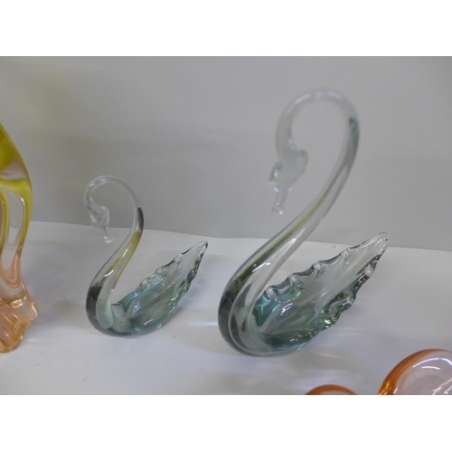 697 - Four items of art glass including two swans, large vase with chips to base