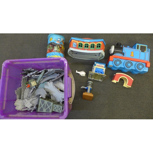 738 - A large collection of Thomas the Tank Engine model trains and other Thomas merchandise