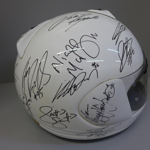 742 - An Arai crash helmet, signed, (de-lacquered, signed and re-lacquered), signatures include Cal Crutch... 