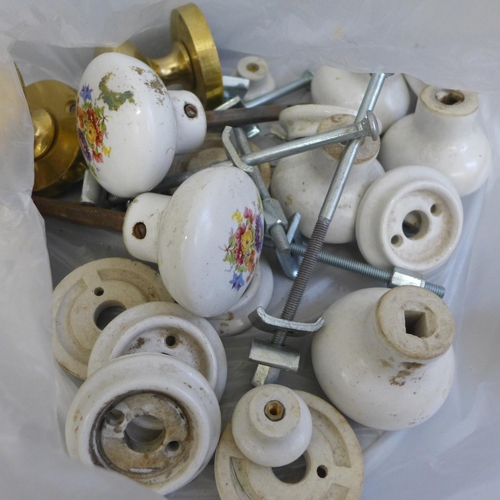 750 - A collection of ceramic and brass door knobs