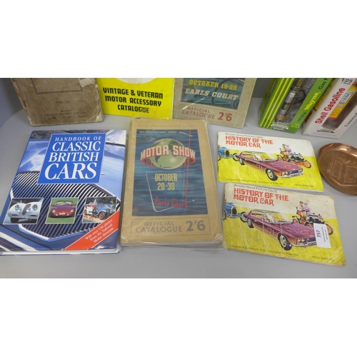 757 - A Pratts Perfection spirit copper pin tray and a collection of car related books, and two model gas ... 