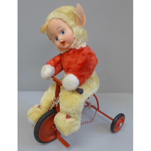762 - A vintage 1950's Chiltern Toys Pixie on a Trike doll, boxed