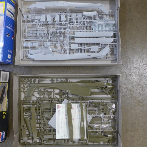 772 - Four model kits comprising two helicopters and two aircraft, Revell, Ertl and Italeri