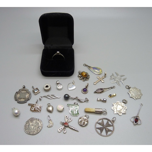 941 - A silver and diamond ring, size Q, and assorted silver pendants, charms, etc.