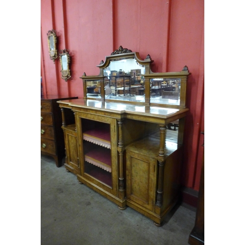 1 - A Victorian figured walnut breakfront mirror-back side cabinet