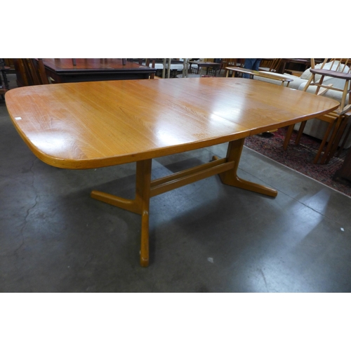 106 - A Danish teak extending dining table