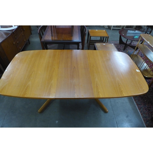 106 - A Danish teak extending dining table