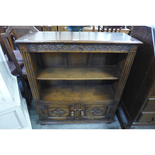 120 - A carved Ipswich oak open bookcase